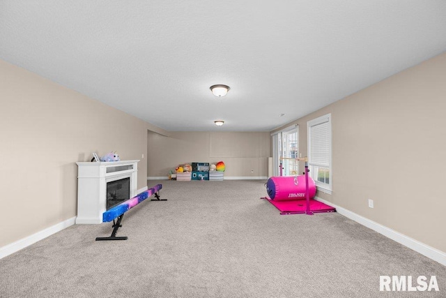 67 Cobblestone Ln, Le Claire, IA 52753 - playroom with carpet and a fireplace