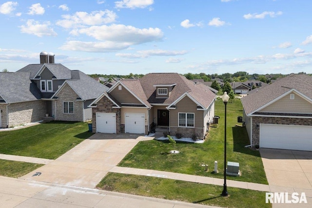 67 Cobblestone Ln, Le Claire, IA 52753 - craftsman house featuring a front yard, driveway, stone siding, and a garage