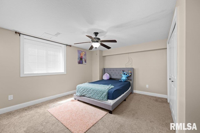 67 Cobblestone Ln, Le Claire, IA 52753 - bedroom with carpet floors, ceiling fan, and a textured ceiling