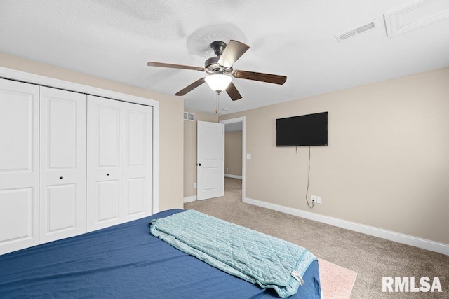 67 Cobblestone Ln, Le Claire, IA 52753 - carpeted bedroom featuring a closet and a ceiling fan