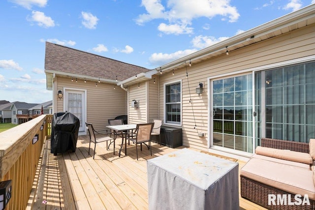 67 Cobblestone Ln, Le Claire, IA 52753 - deck with outdoor dining space and a jacuzzi