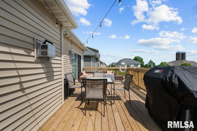 67 Cobblestone Ln, Le Claire, IA 52753 - wooden deck with outdoor dining area and grilling area