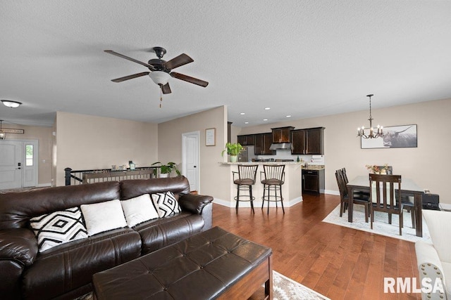 67 Cobblestone Ln, Le Claire, IA 52753 - living area featuring a chandelier, dark wood-style flooring, ceiling fan, and recessed lighting
