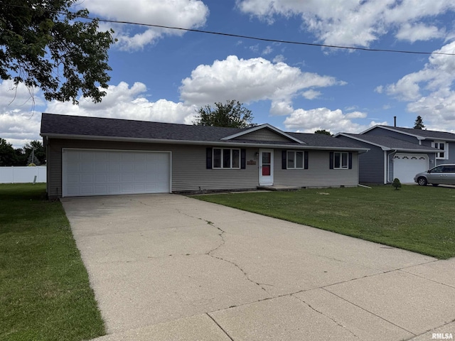 172 E Meadow Ln, Walcott, IA 52773 - single story home with a garage, concrete driveway, and a front lawn
