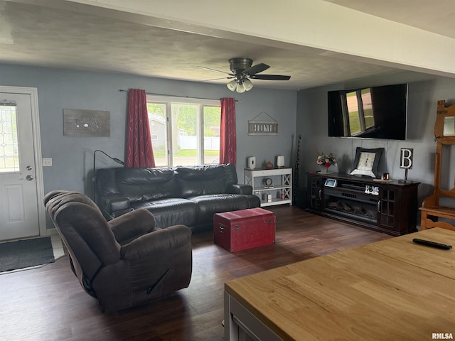 172 E Meadow Ln, Walcott, IA 52773 - living room featuring dark wood-style flooring and ceiling fan