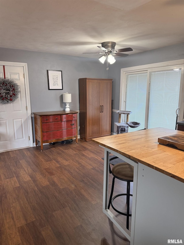 172 E Meadow Ln, Walcott, IA 52773 - dining room featuring dark wood finished floors and a ceiling fan