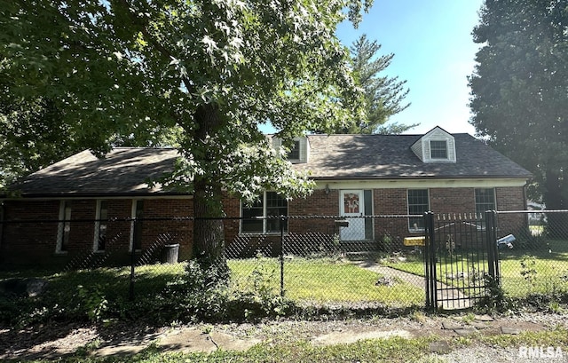 900 E 4th St, West Frankfort, IL 62896 - view of front of home featuring a fenced front yard, brick siding, a gate, and roof with shingles