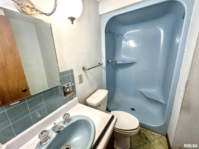 900 E 4th St, West Frankfort, IL 62896 - full bathroom with vanity and a shower