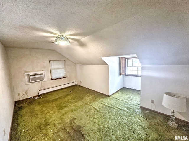 900 E 4th St, West Frankfort, IL 62896 - bonus room with a baseboard radiator, an AC wall unit, a textured ceiling, lofted ceiling, and carpet