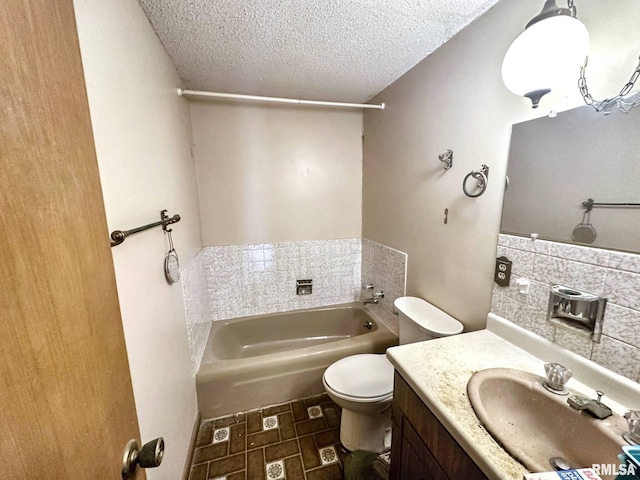 900 E 4th St, West Frankfort, IL 62896 - full bathroom with a garden tub, vanity, and a textured ceiling