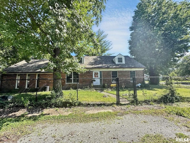 900 E 4th St, West Frankfort, IL 62896 - view of front of property featuring brick siding and a fenced front yard