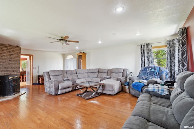 829 Union Ave, Lowden, IA 52255 - living area featuring ceiling fan, light wood-style floors, recessed lighting, and a wood stove