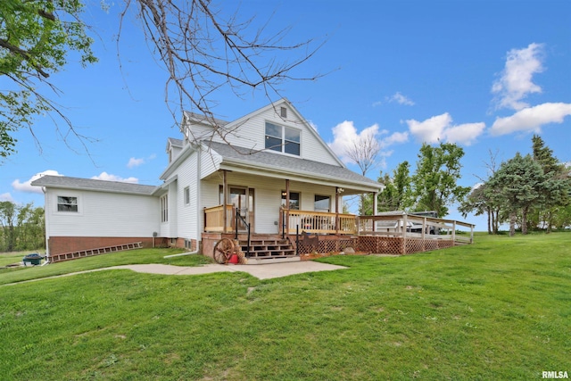 829 Union Ave, Lowden, IA 52255 - view of front of house featuring a front yard, a patio area, and a deck