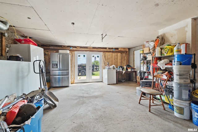 829 Union Ave, Lowden, IA 52255 - below grade area featuring stainless steel fridge, french doors, and washer / clothes dryer