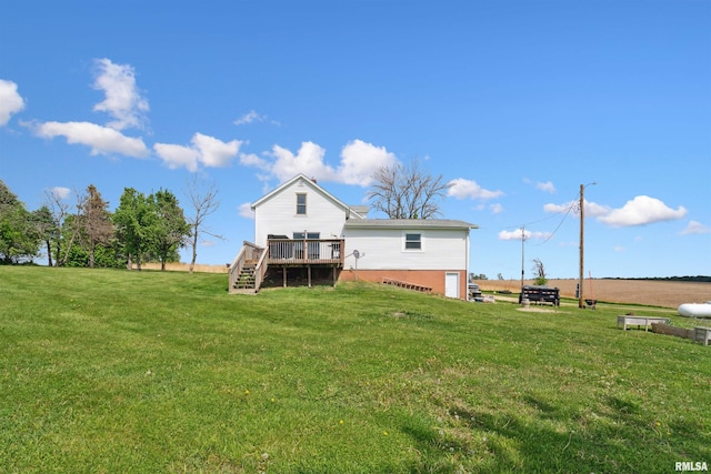 829 Union Ave, Lowden, IA 52255 - rear view of property with stairs, a wooden deck, and a yard