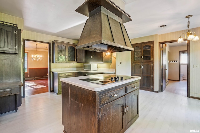 2351 5th St, East Moline, IL 61244 - kitchen featuring wallpapered walls, a chandelier, island range hood, electric cooktop, and light wood-style flooring