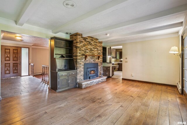 2351 5th St, East Moline, IL 61244 - unfurnished living room featuring beamed ceiling, a textured ceiling, wood finished floors, and crown molding