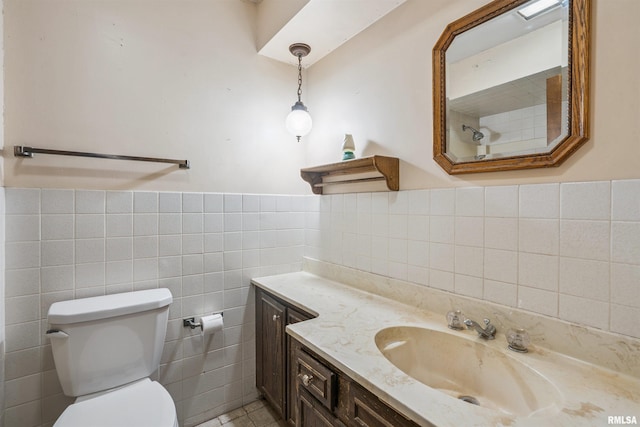 2351 5th St, East Moline, IL 61244 - full bath featuring vanity, tile walls, and a wainscoted wall