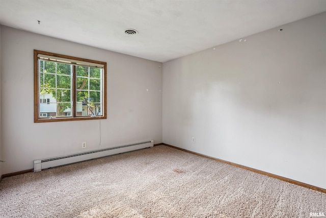 2351 5th St, East Moline, IL 61244 - spare room with a baseboard heating unit and carpet floors