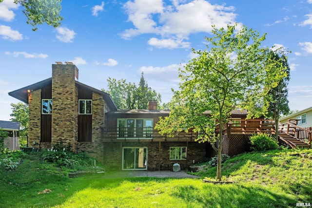 2351 5th St, East Moline, IL 61244 - rear view of property with a chimney and a wooden deck