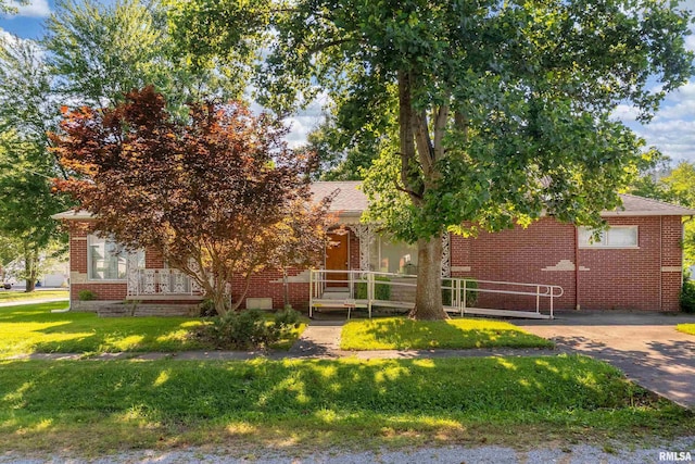 613 S Locust, West Frankfort, IL 62896 - obstructed view of property with brick siding and a front lawn
