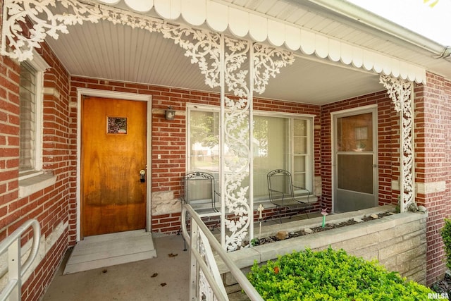 613 S Locust, West Frankfort, IL 62896 - view of exterior entry featuring brick siding and covered porch