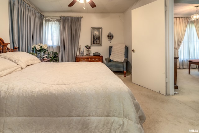 613 S Locust, West Frankfort, IL 62896 - bedroom with light carpet, crown molding, and ceiling fan