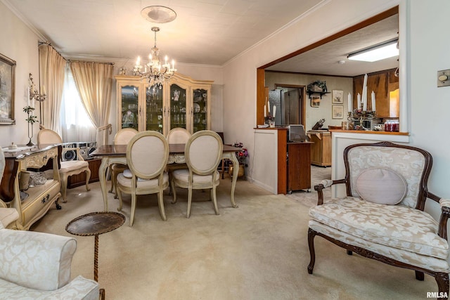 613 S Locust, West Frankfort, IL 62896 - dining room featuring ornamental molding, a chandelier, and light colored carpet