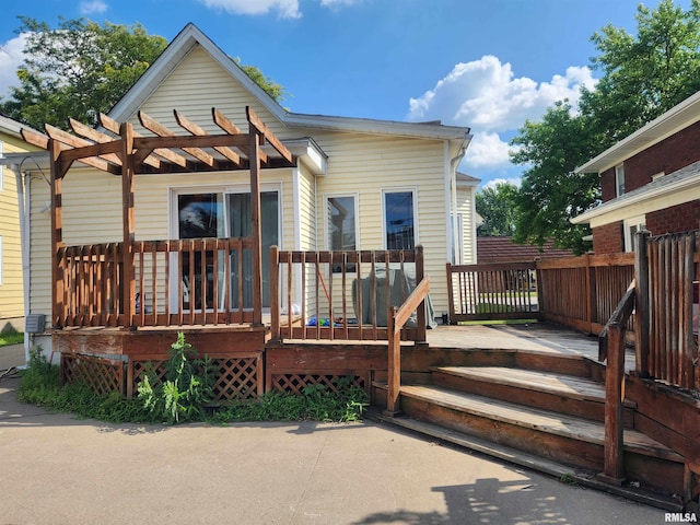 3217 18th Ave, Rock Island, IL 61201 - back of house with a deck and a pergola