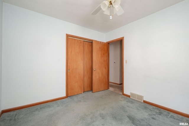 2518 13th St, Rock Island, IL 61201 - unfurnished bedroom featuring carpet floors, a closet, and a ceiling fan