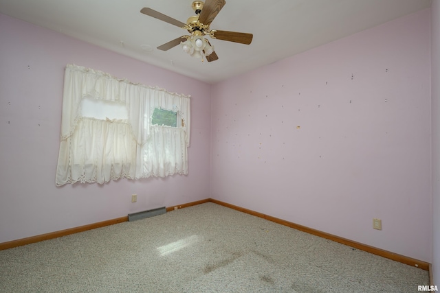 2518 13th St, Rock Island, IL 61201 - carpeted empty room featuring baseboards and a ceiling fan