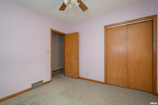 2518 13th St, Rock Island, IL 61201 - unfurnished bedroom with a closet, a ceiling fan, and carpet floors