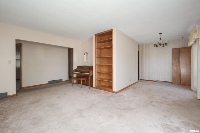 2518 13th St, Rock Island, IL 61201 - unfurnished living room with a chandelier and carpet