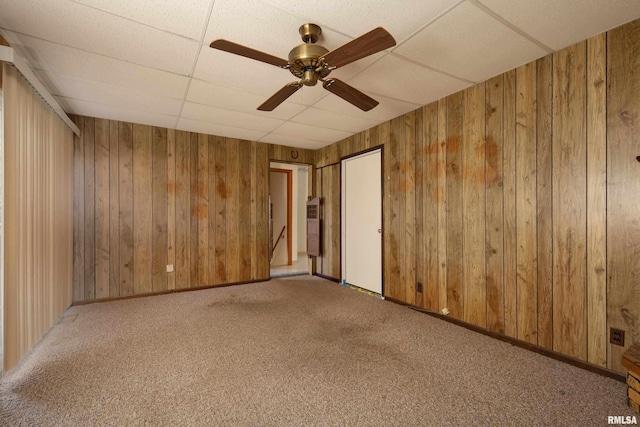 2518 13th St, Rock Island, IL 61201 - carpeted empty room with wooden walls, ceiling fan, and heating unit