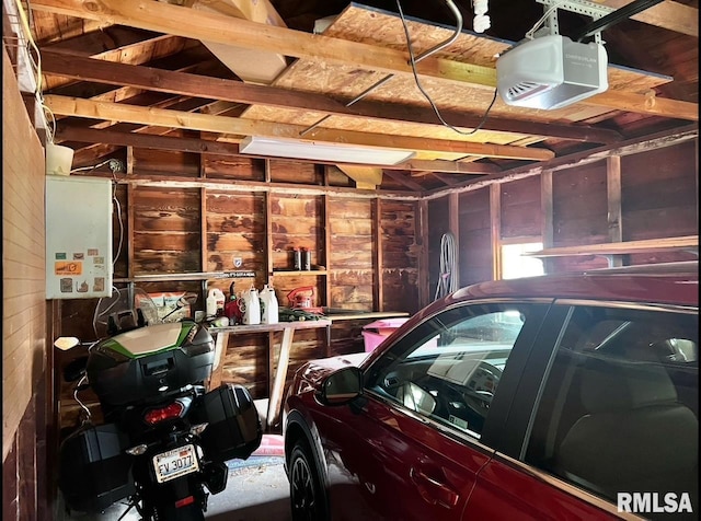 402 SW 7th Ave, Aledo, IL 61231 - garage with wooden walls and a garage door opener