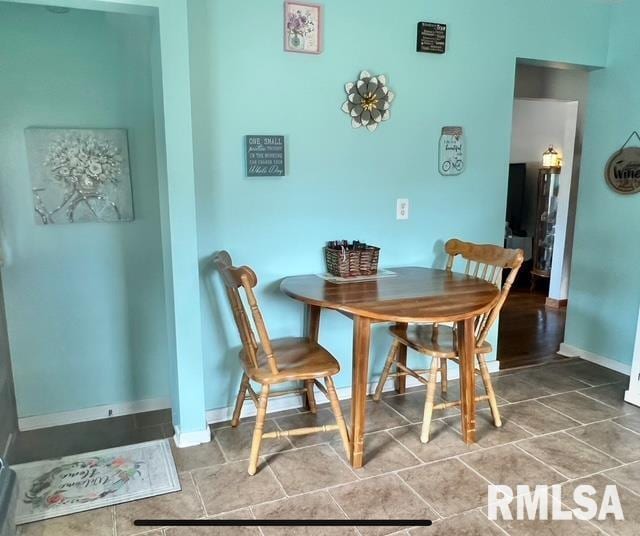 402 SW 7th Ave, Aledo, IL 61231 - tiled dining room featuring baseboards
