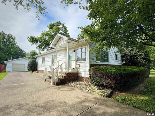 208BAGGOTT None St, Zeigler, IL 62999 - view of front facade with an outbuilding, driveway, and a detached garage