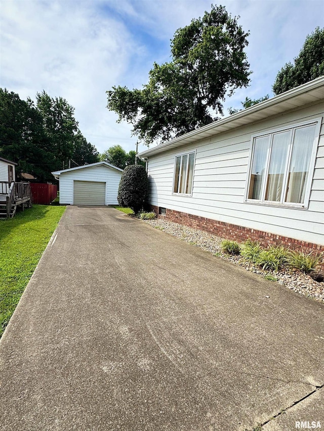 208BAGGOTT None St, Zeigler, IL 62999 - view of home's exterior with an outbuilding, a garage, asphalt driveway, and a lawn