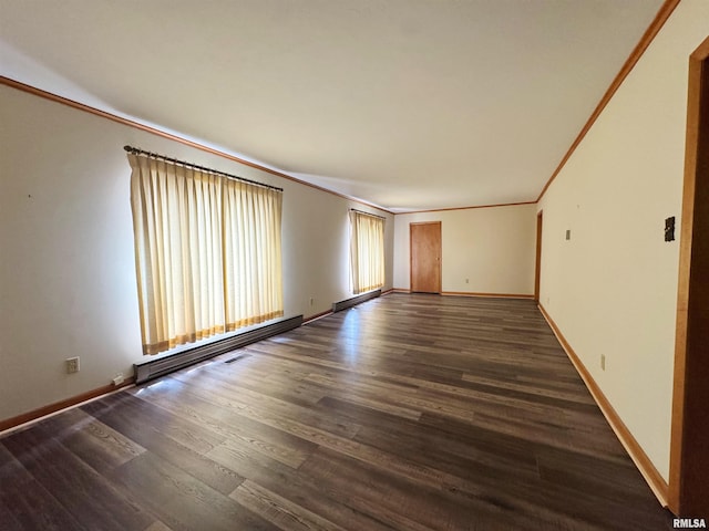 208BAGGOTT None St, Zeigler, IL 62999 - spare room with crown molding, wood finished floors, and a baseboard heating unit