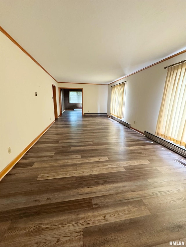 208BAGGOTT None St, Zeigler, IL 62999 - spare room with dark wood-style flooring, ornamental molding, a baseboard heating unit, and a baseboard radiator