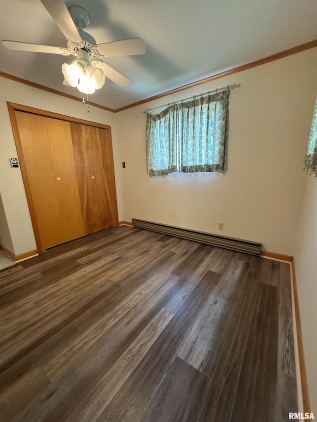 208BAGGOTT None St, Zeigler, IL 62999 - unfurnished bedroom with baseboard heating, a closet, wood finished floors, a ceiling fan, and ornamental molding