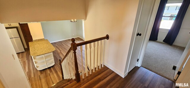 2337 Cameron Dr, Clinton, IA 52732 - stairway with baseboards and wood finished floors