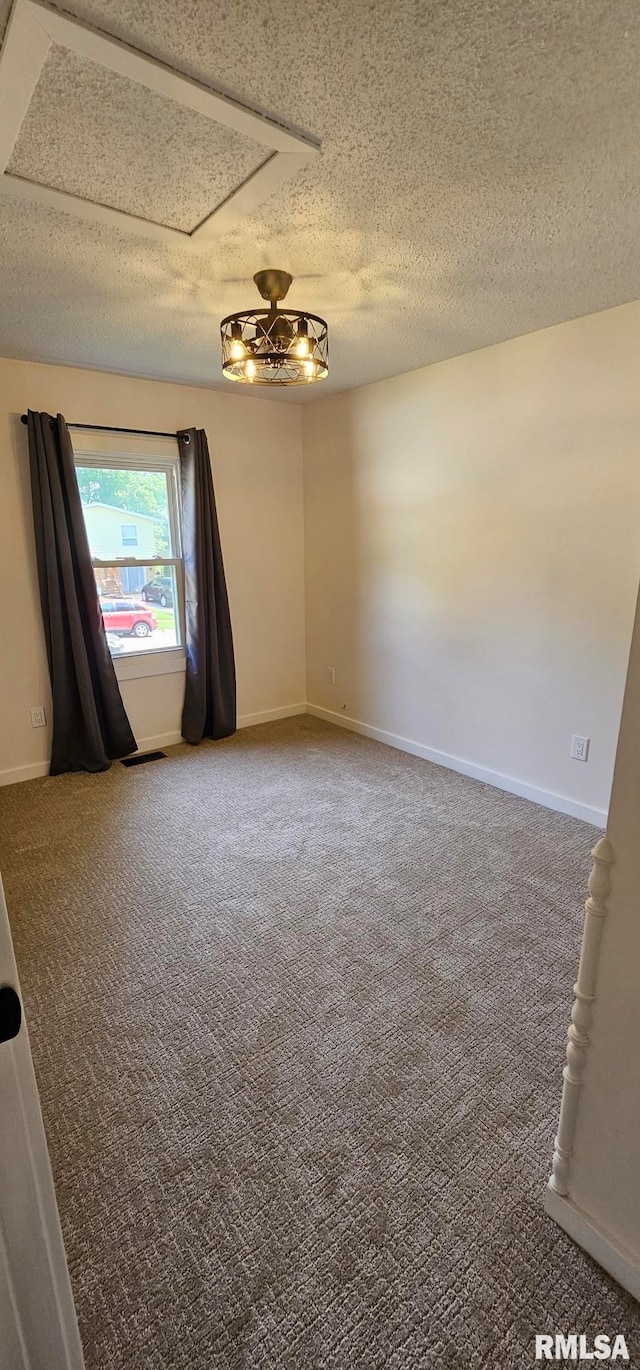 2337 Cameron Dr, Clinton, IA 52732 - spare room with carpet floors and a textured ceiling