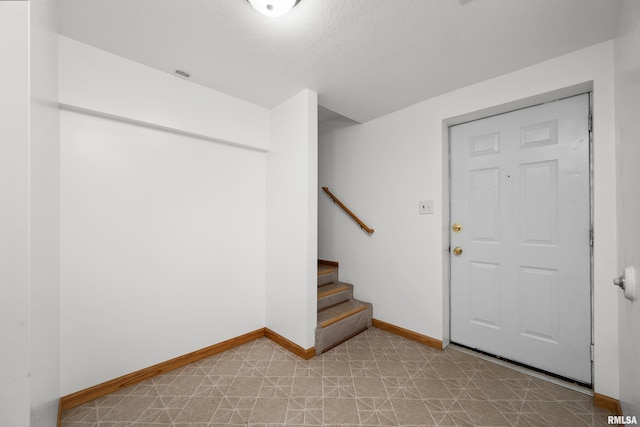 222 6th St, Buffalo, IA 52728 - entrance foyer featuring stairway and light floors