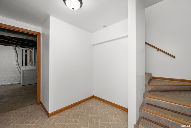 222 6th St, Buffalo, IA 52728 - stairway with washer / dryer and baseboards