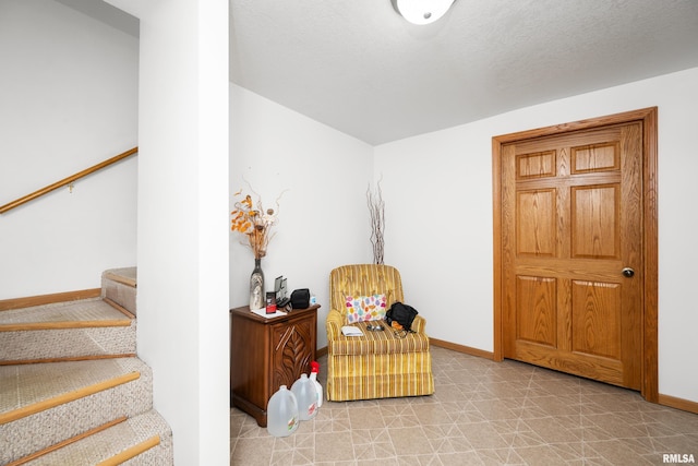 222 6th St, Buffalo, IA 52728 - living area with stairs and light flooring