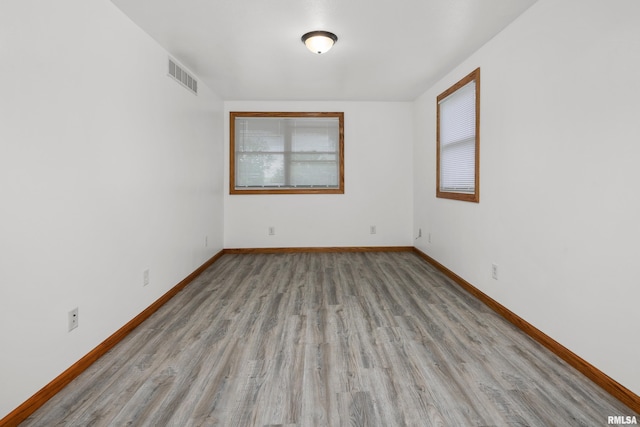 222 6th St, Buffalo, IA 52728 - unfurnished room featuring wood finished floors and baseboards