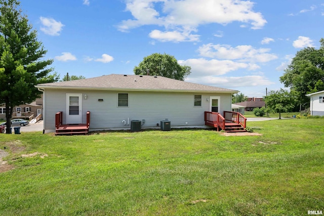 222 6th St, Buffalo, IA 52728 - back of property with a wooden deck and a lawn