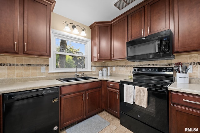 4040 27th Ave, Rock Island, IL 61201 - kitchen featuring black appliances, tasteful backsplash, and light countertops