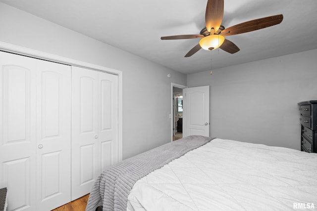 4040 27th Ave, Rock Island, IL 61201 - bedroom featuring a closet, wood finished floors, and a ceiling fan